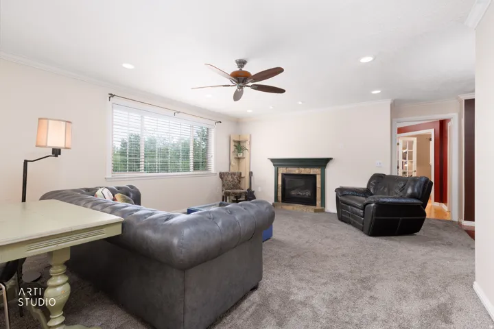 Plush carpet flooring, recessed lighting, and a ceiling fan with a light kit