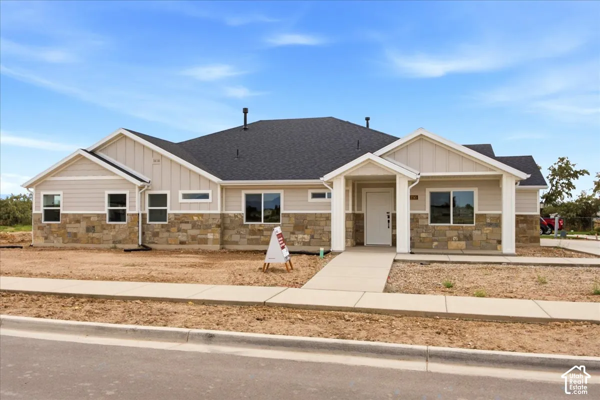 North facing front door view of home exterior.