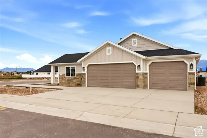 West facing 3- car garage view of exterior.