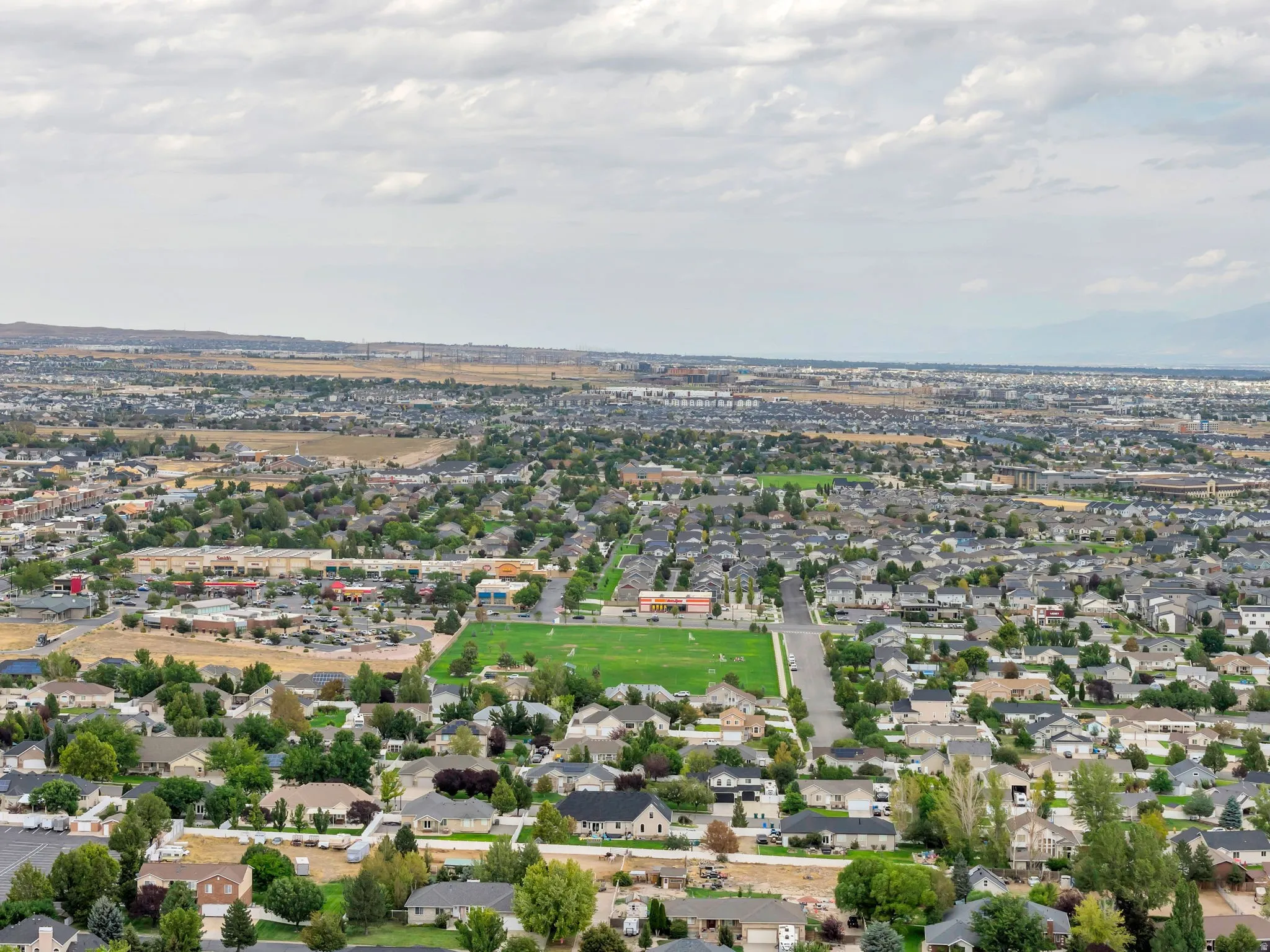 Aerial perspective showcasing an expansive residential area with varied housing styles
