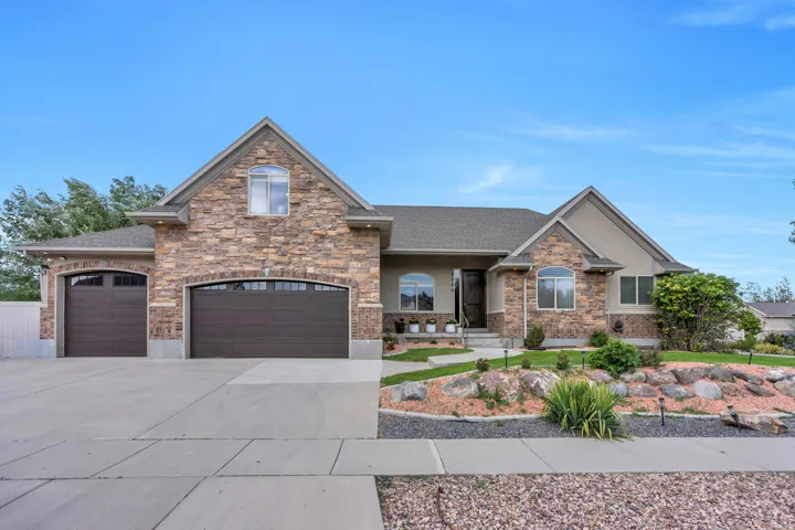 Stone and stucco exterior with gabled roof lines