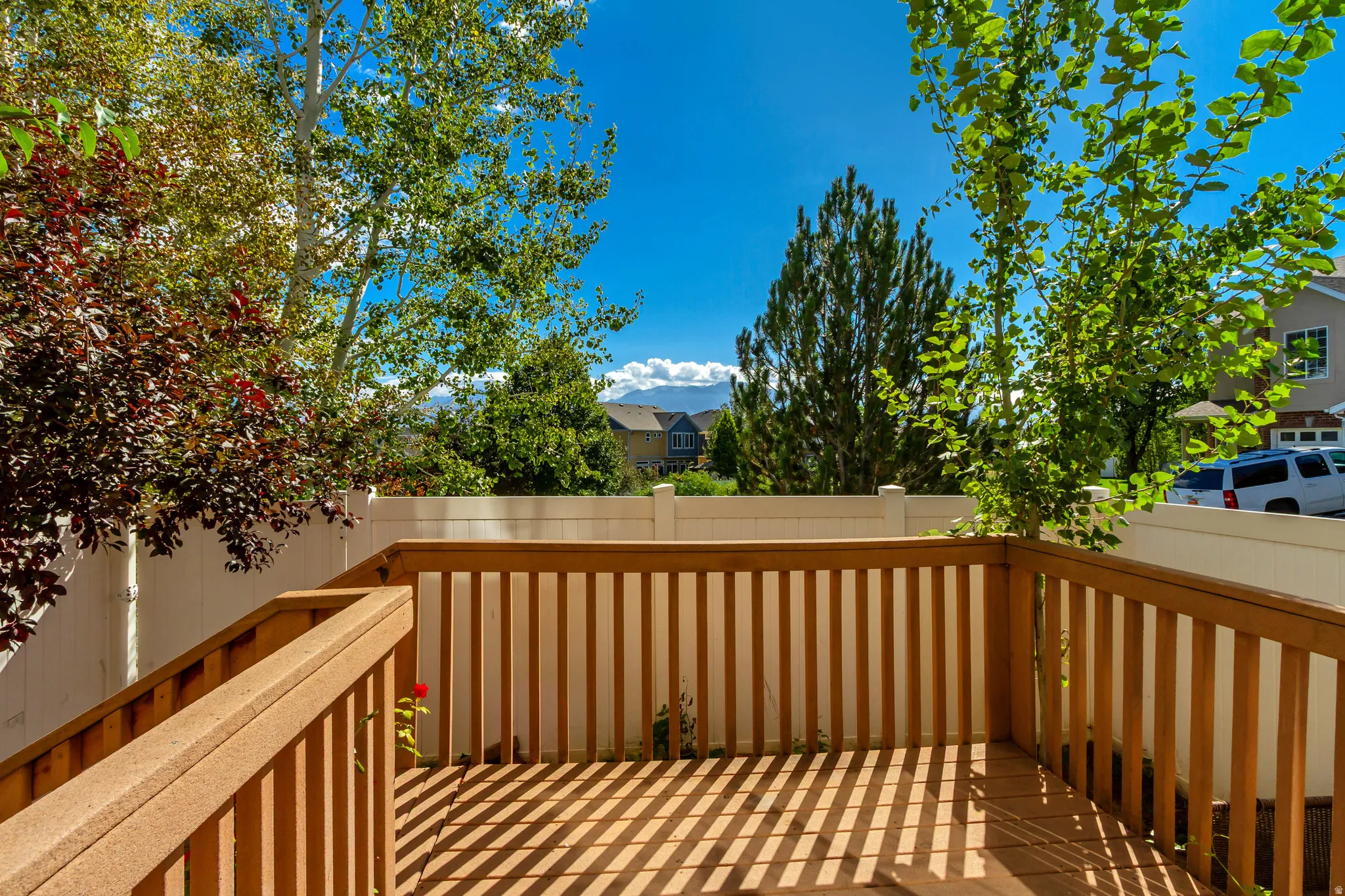 Wood-tone deck with matching railings and balusters