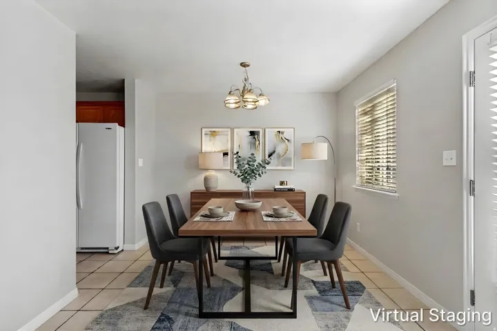 Tile flooring, light gray walls, built-in window with blinds, and overhead lighting fixture