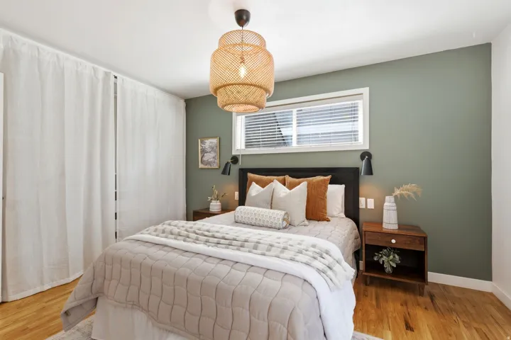 Hardwood flooring throughout, with a woven pendant light fixture