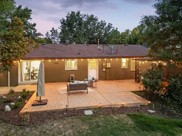 Expansive stamped concrete patio with embedded outdoor lighting