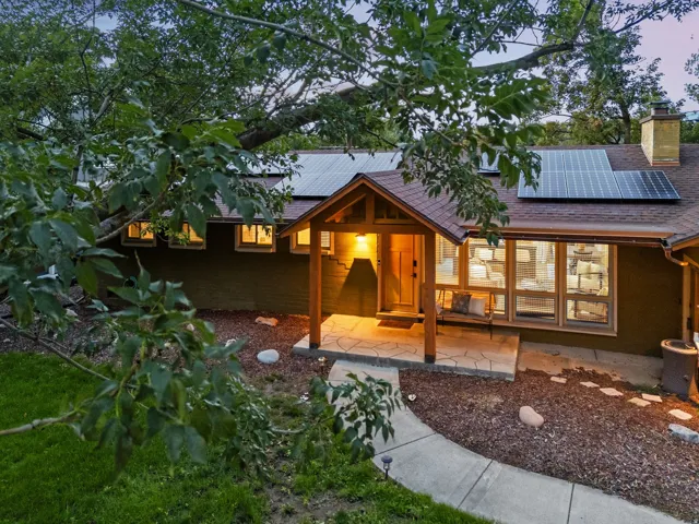 Craftsman-style entry with stone patio