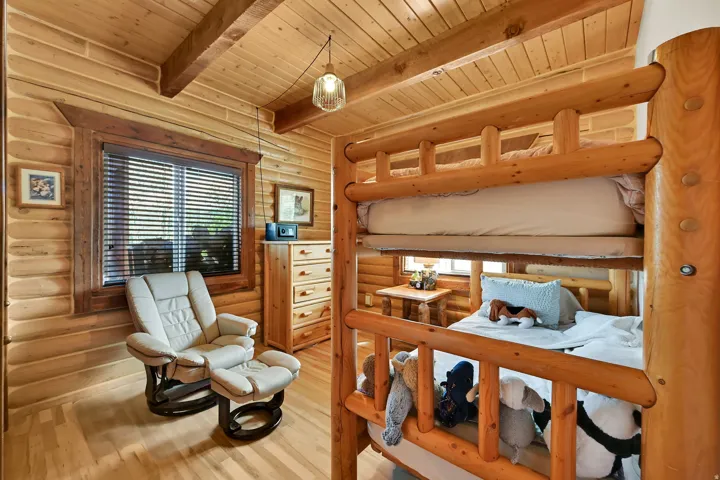 Wood-finish plank flooring with exposed wood beam ceiling