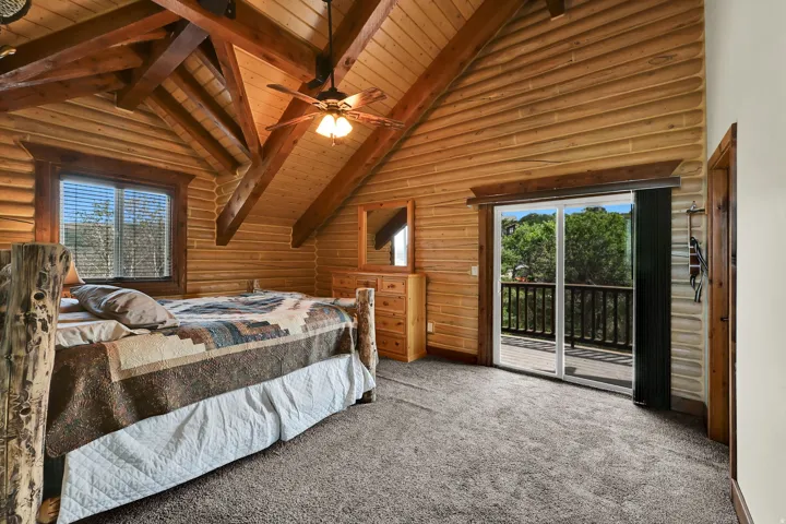 Vaulted wood-paneled ceiling with exposed beams
