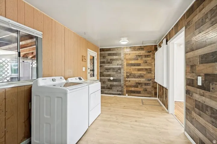 Wood-finish flooring with accent wood-paneled walls