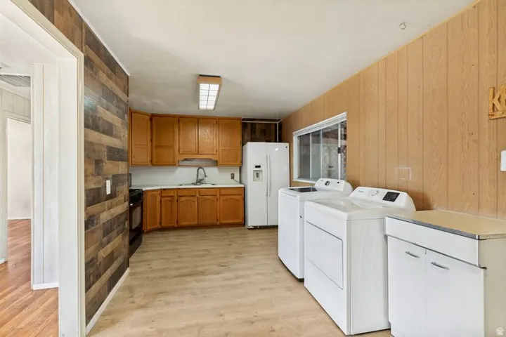 Wood-finish flooring throughout, complemented by wood-finish wall paneling