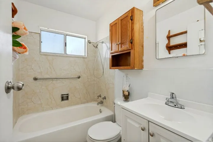 Wall-mounted wood-finish cabinet with open shelving