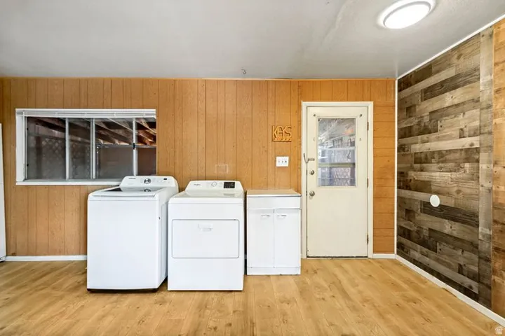 Wood-finish flooring with horizontal paneling and a contrasting plank accent wall