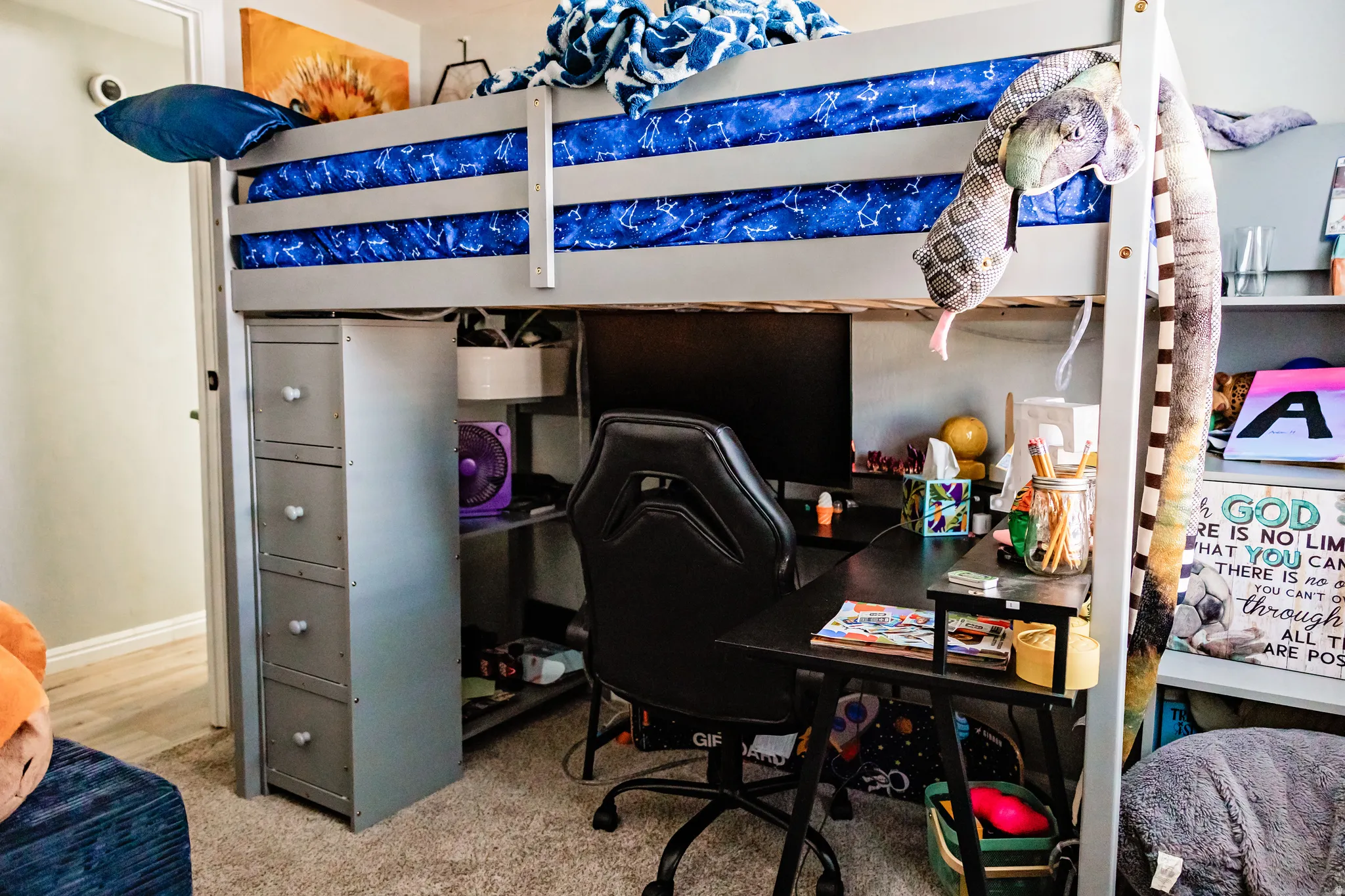 Built-in loft bed with integrated desk space and shelving