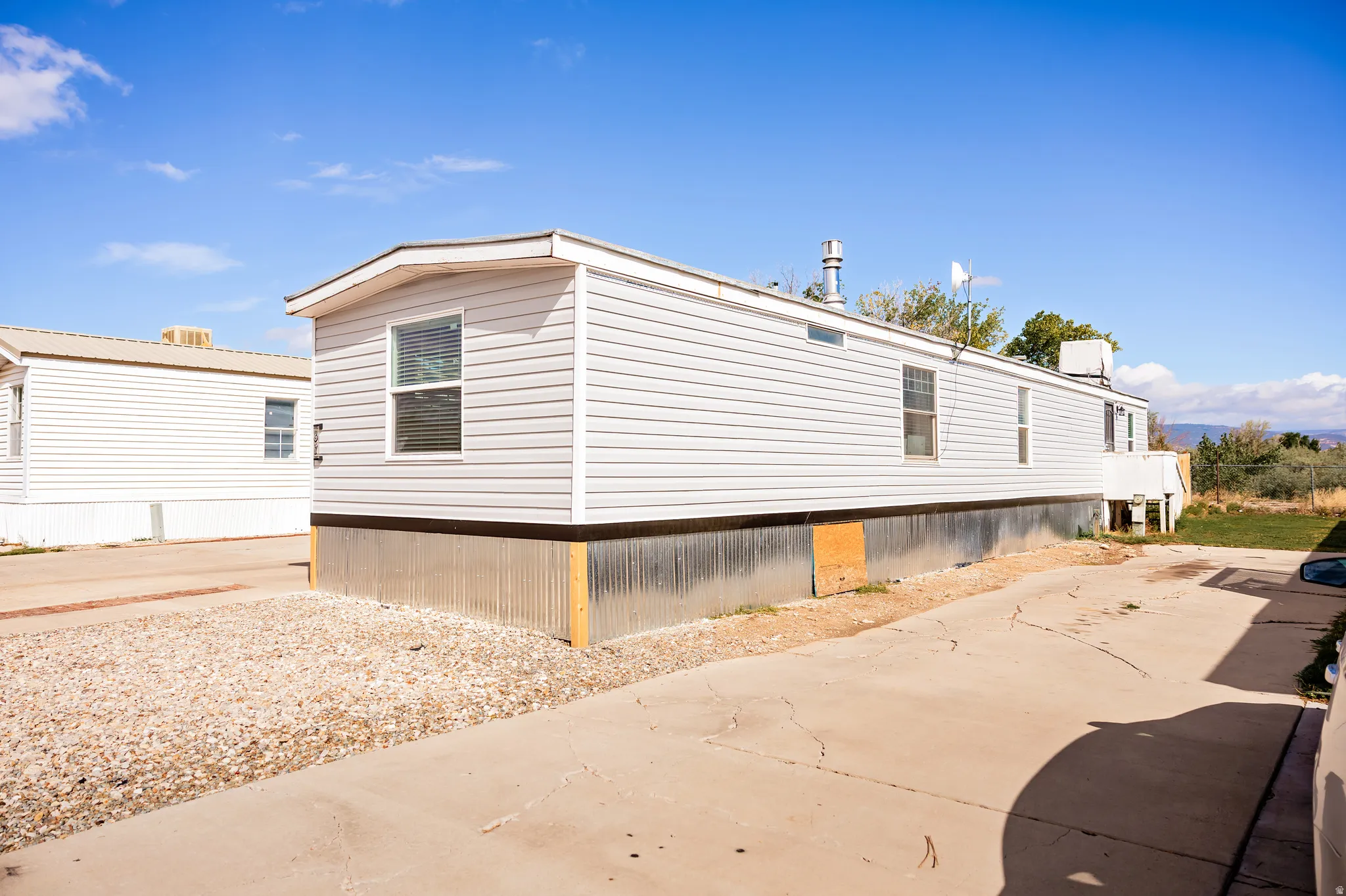 White vinyl siding exterior with multiple windows