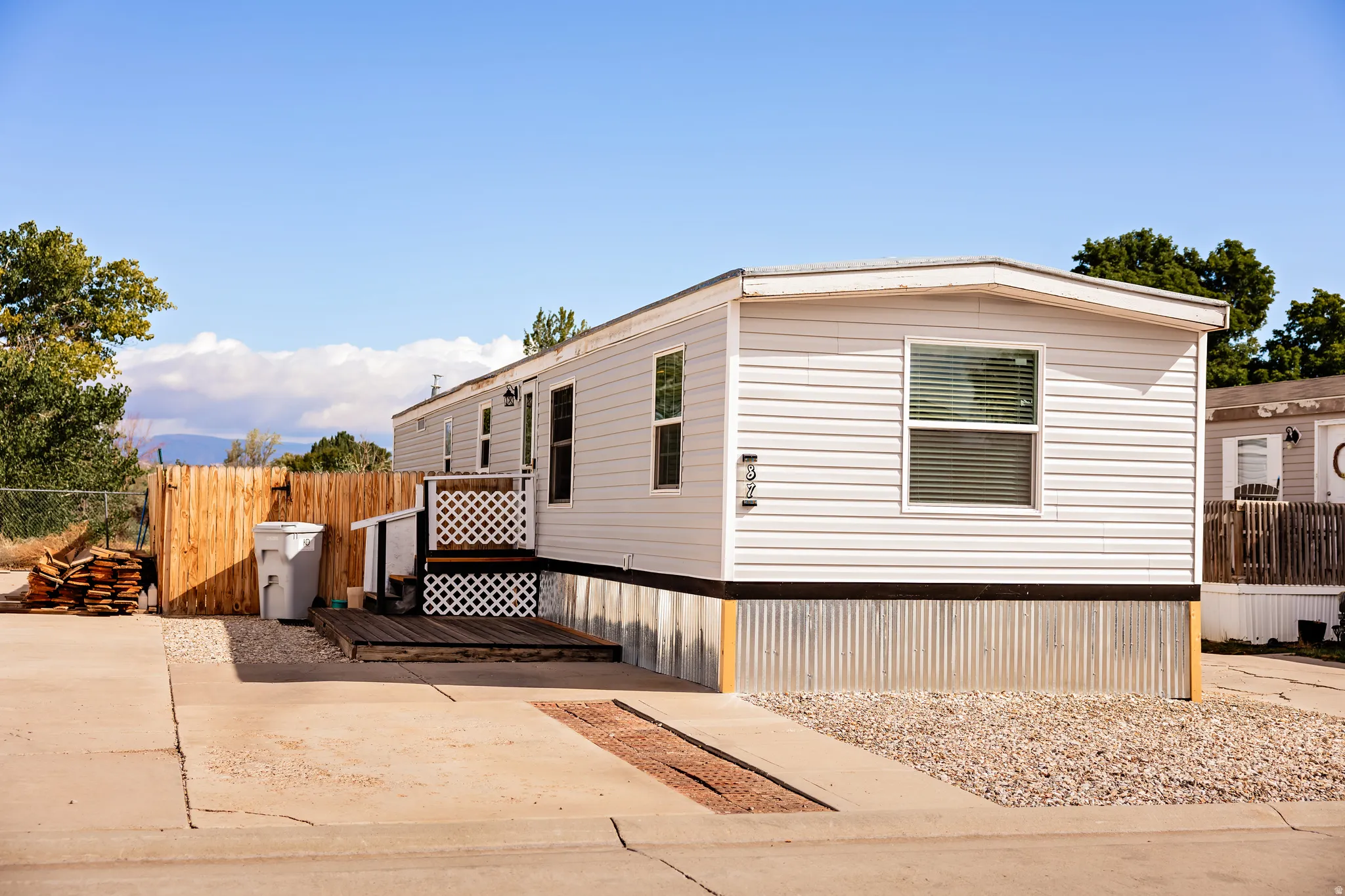 White siding exterior with a pitched roof