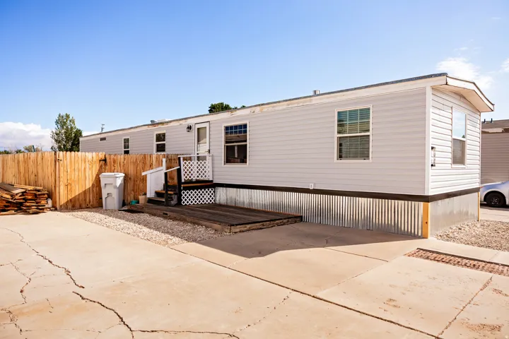Light-colored siding exterior with multiple windows