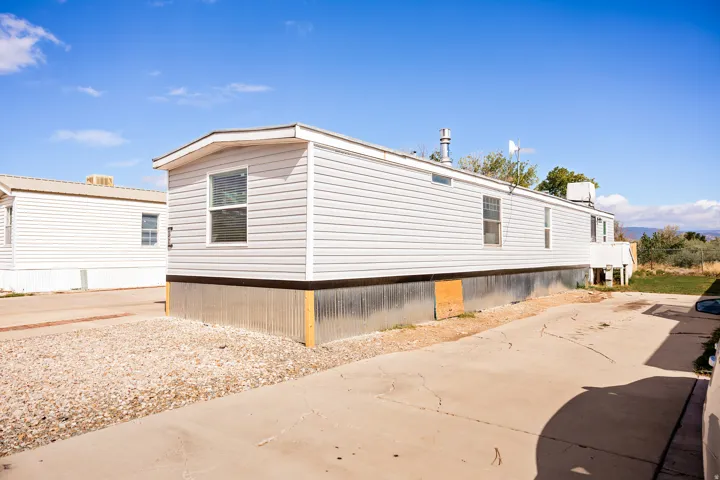 White vinyl siding exterior with multiple windows