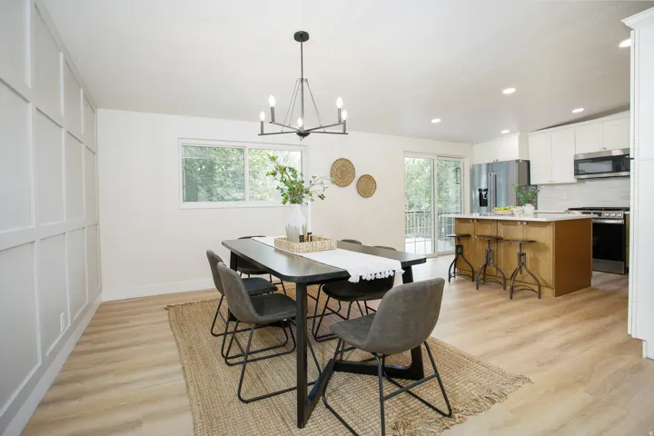 Open-concept living space with wood-finish flooring