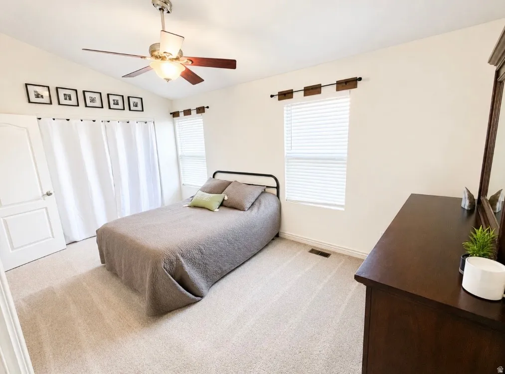 Recessed lighting with a ceiling fan, light-colored carpeting, white interior door, and window with blinds