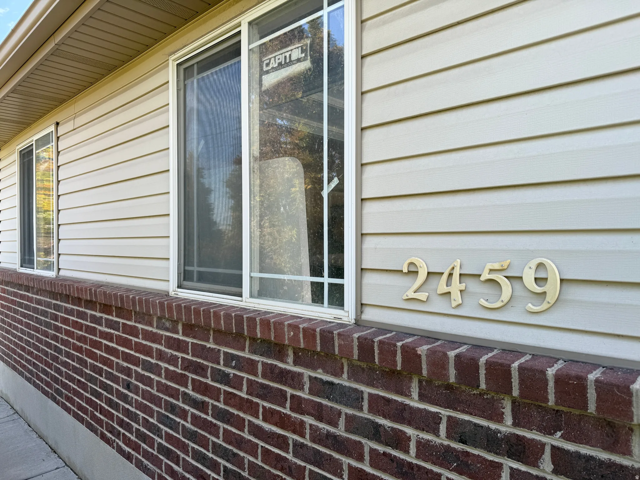 Brick and siding exterior with multiple windows