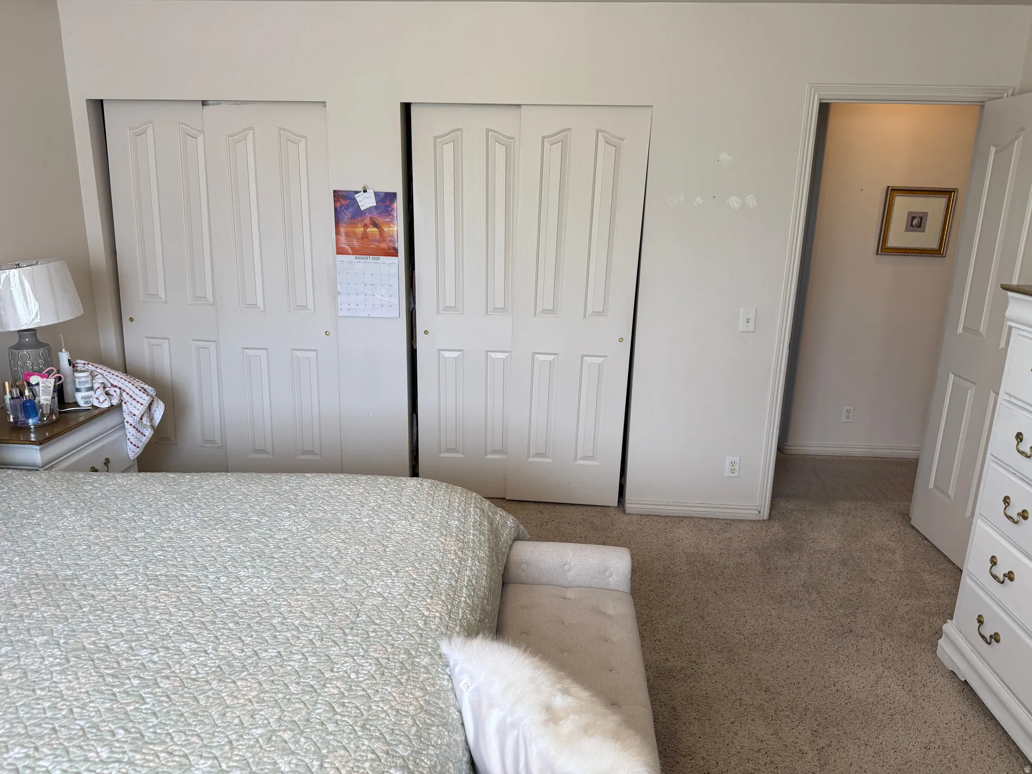 Other view of the Master Bedroom. Wall-to-wall carpeting and white bi-fold closet doors