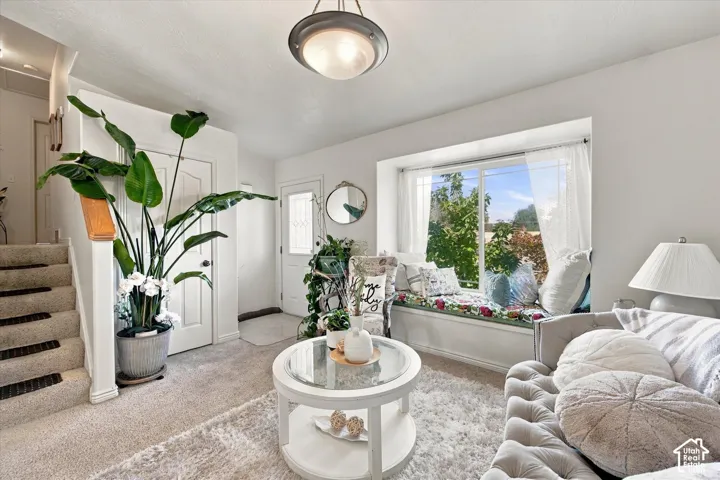 Carpeted flooring, built-in window seat, and white interior doors