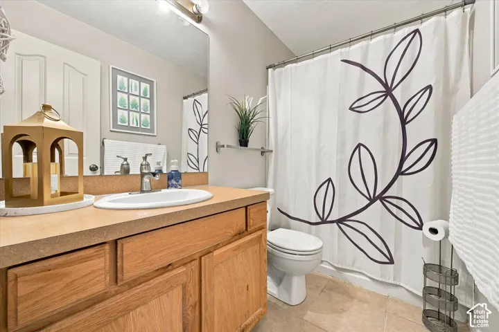 Wood-finish vanity with an integrated sink and chrome faucet