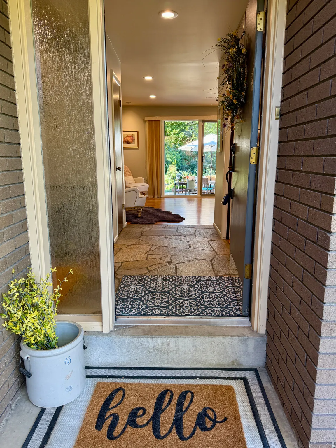 Brick exterior wall with a frosted glass sidelight