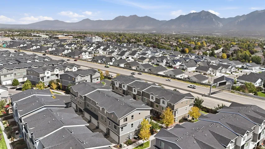 Aerial perspective showcasing residential development with a mountain backdrop