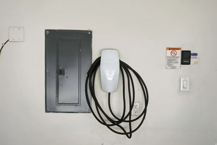 Electrical panel with a white electric vehicle charging station