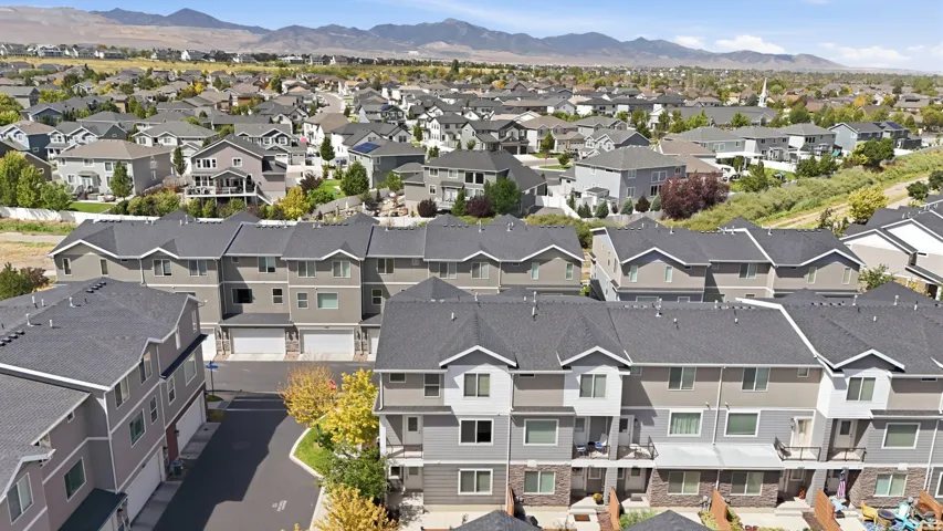 Multi-level townhome community with attached garages and balconies