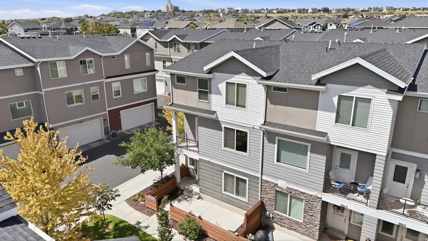 Multi-level townhouse with a stone and siding exterior