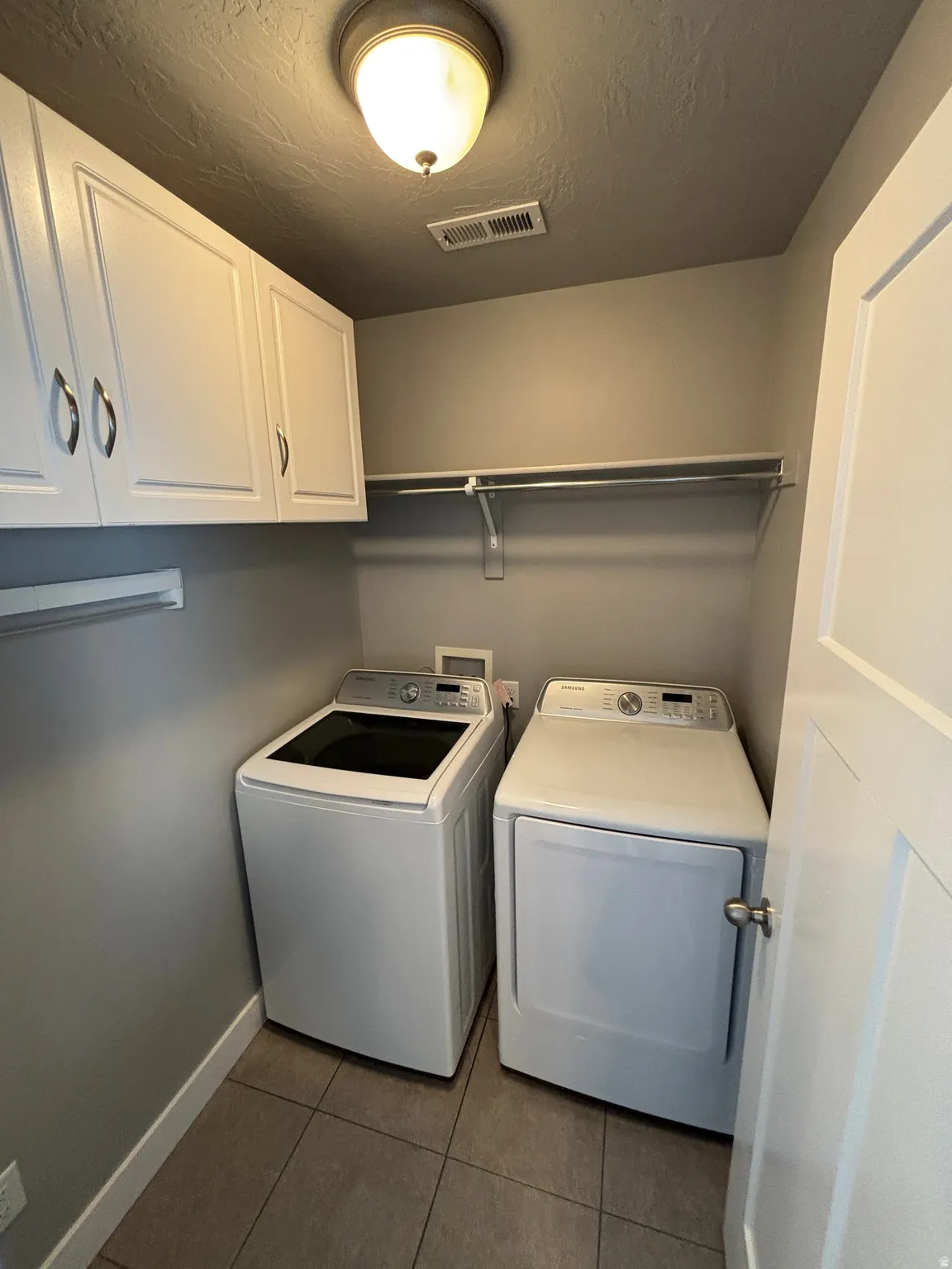 White upper cabinetry with brushed nickel hardware