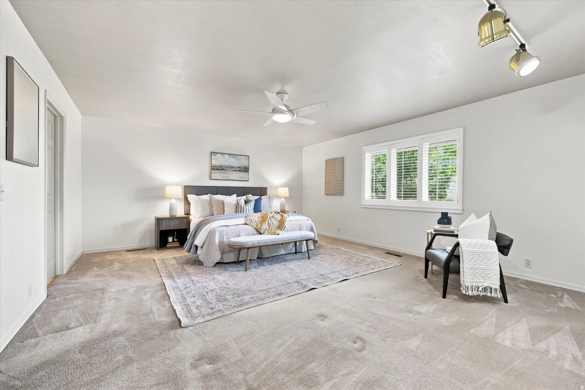 Light and bright, main level spacious primary bedroom.