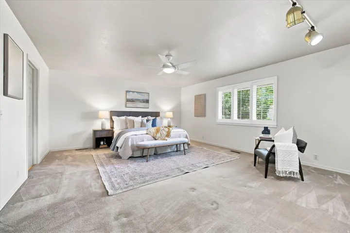 Light and bright, main level spacious primary bedroom.