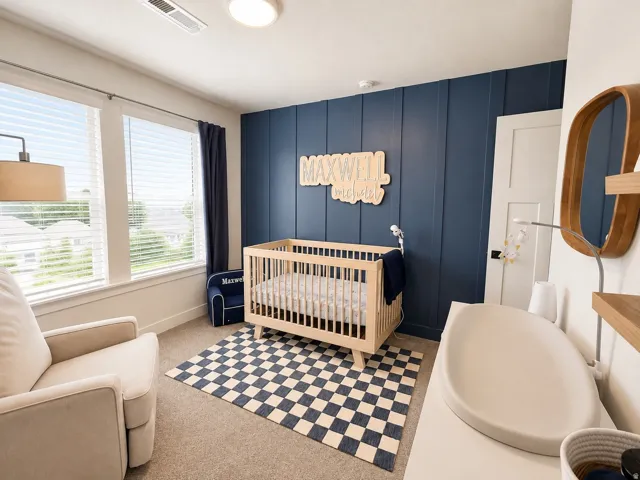 Accent wall with vertical paneling, recessed lighting, and expansive windows