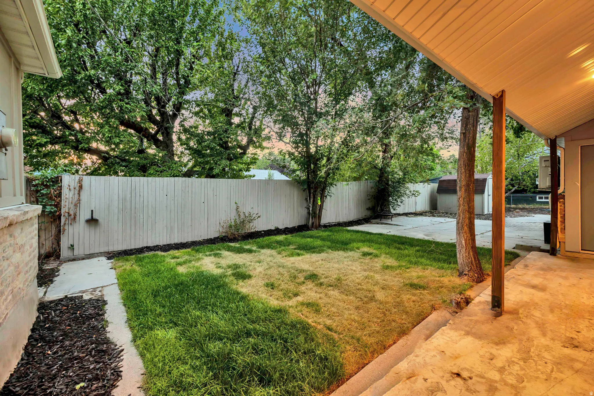 Covered patio space with concrete flooring