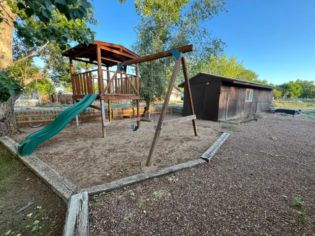 Wooden playset with slide and swing