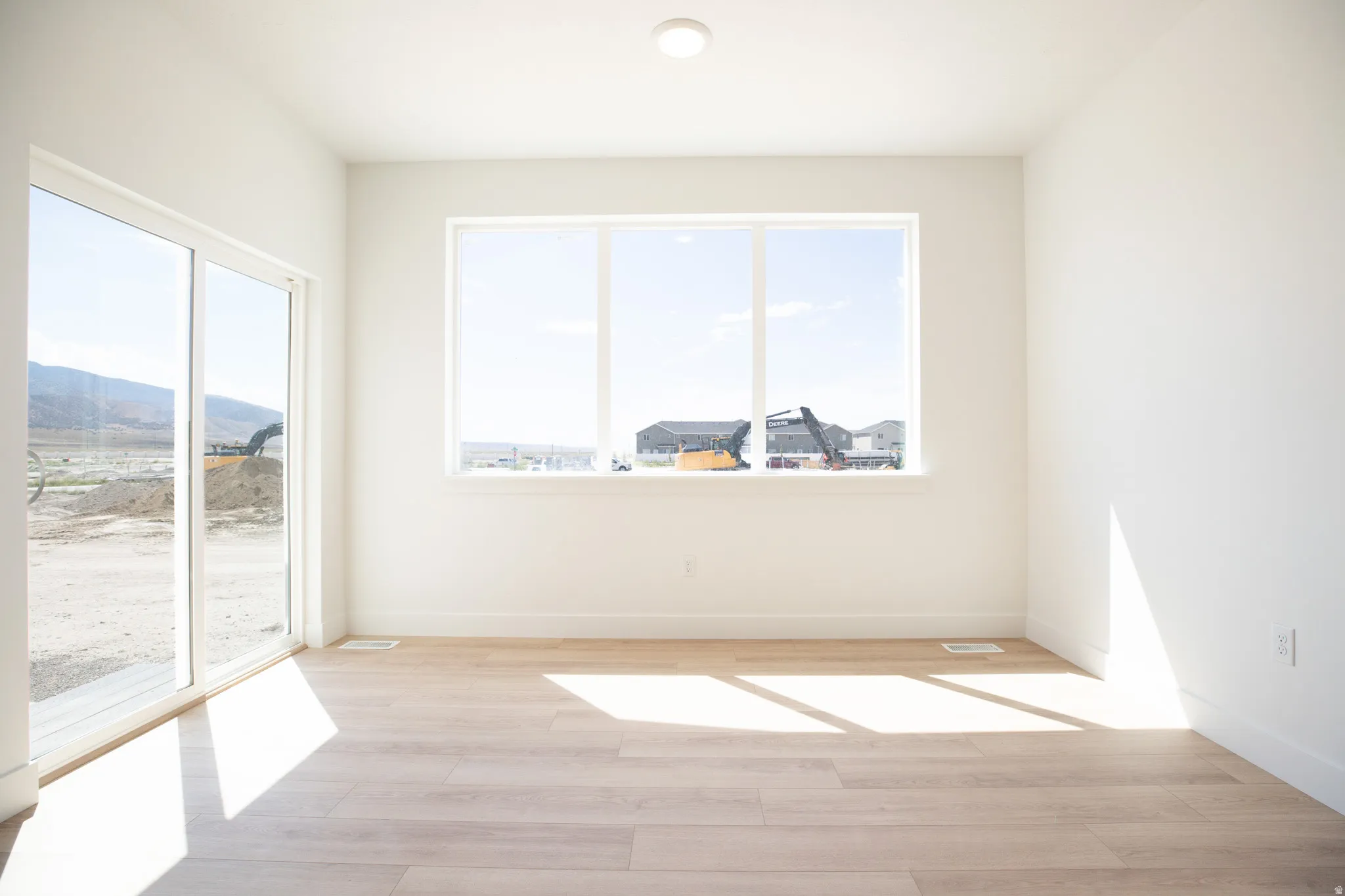 Open dining area with sliding glass door adjacent to the kitchen.