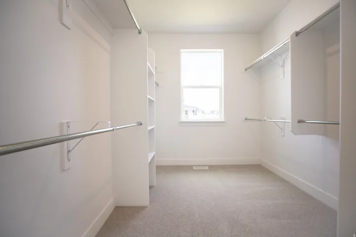 Large walk-in closet as part of primary suite on main level.