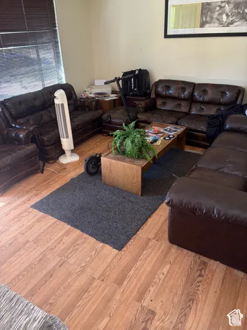 Wood-finish flooring throughout the room
