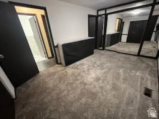 Wall-to-wall carpeting and mirrored wall features