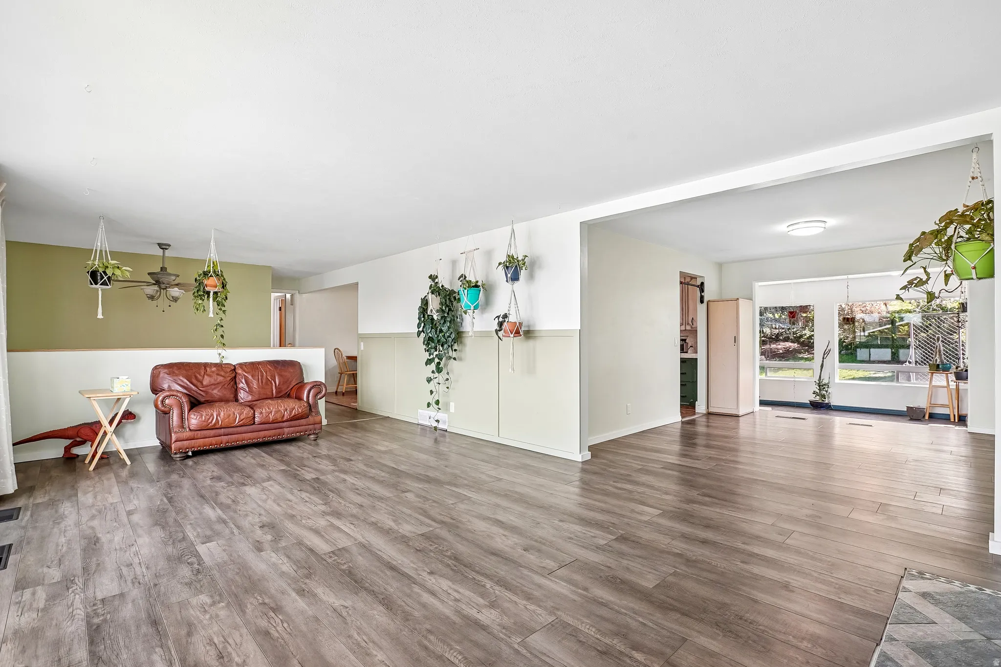 Wood-finish flooring throughout, with a neutral color palette
