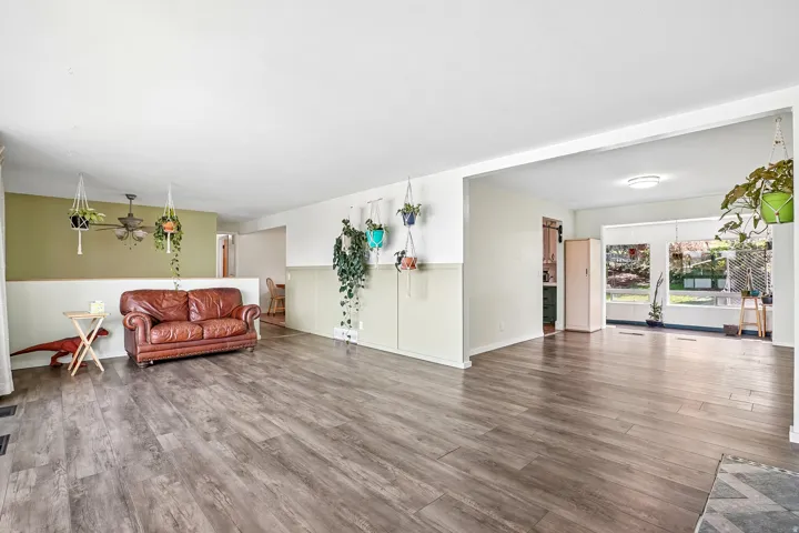 Wood-finish flooring throughout, with a neutral color palette