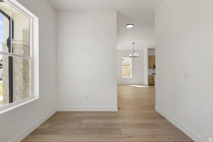 Wood-finish flooring throughout, providing a consistent surface