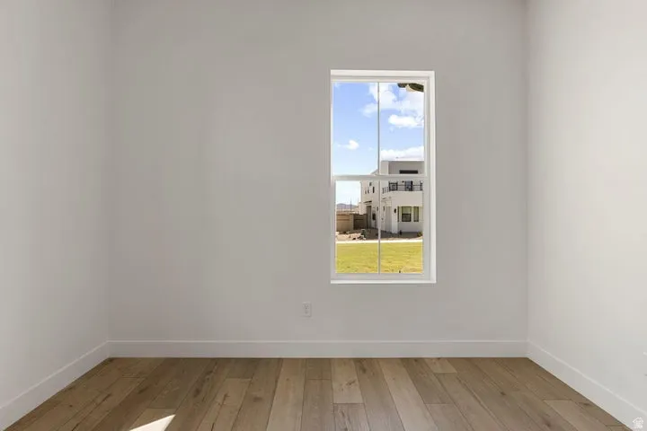 Wood-finish flooring with white wall finishes