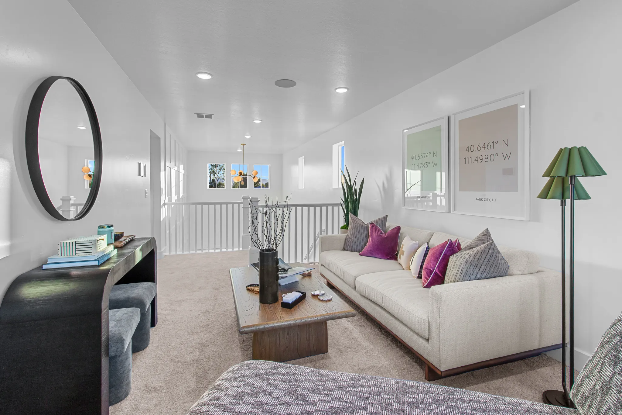 Carpeted loft space featuring bright white walls, recessed lighting, and a white balustrade overlooking a lower level