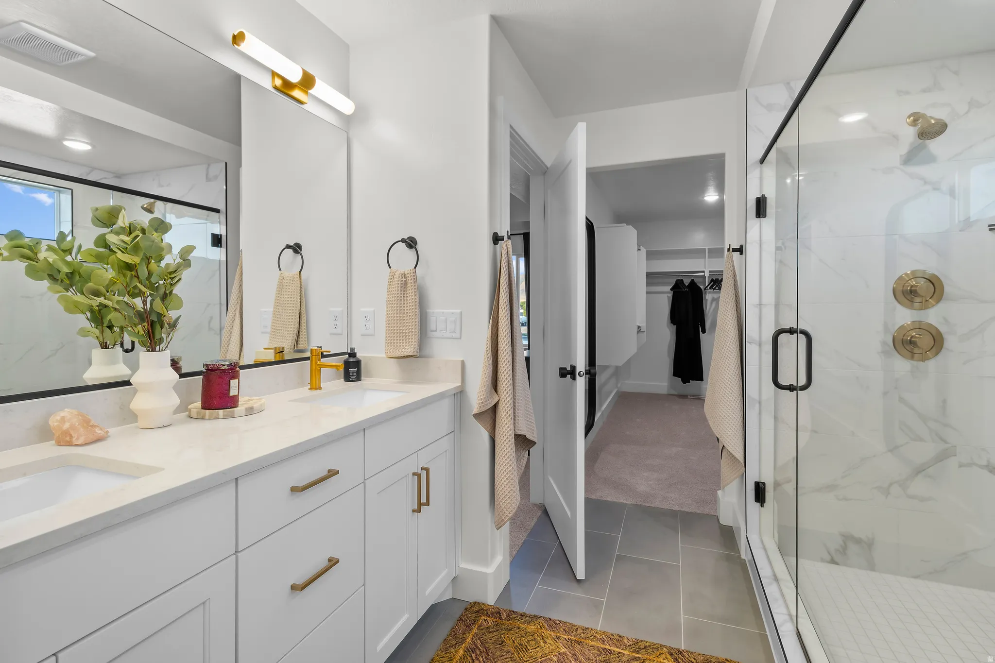 Dual vanity with integrated sinks and gold-finish faucets