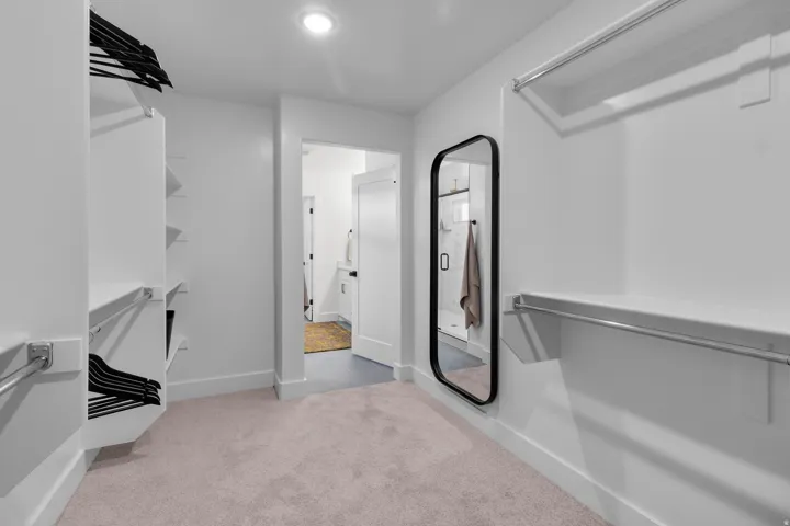 Custom closet system with shelving and hanging rods