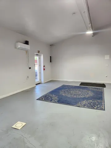 Vaulted ceiling with track lighting and recessed lighting